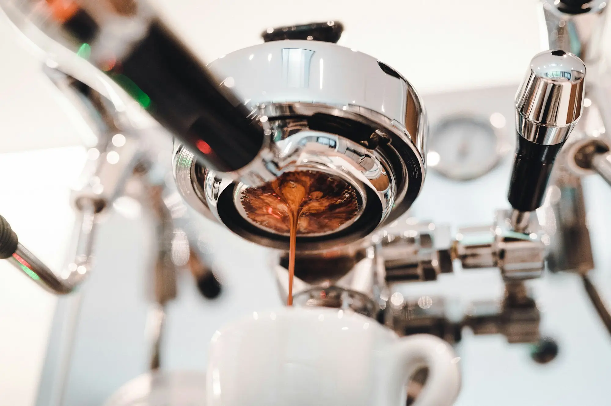 Espresso pouring from a newly installed commercial coffee machine