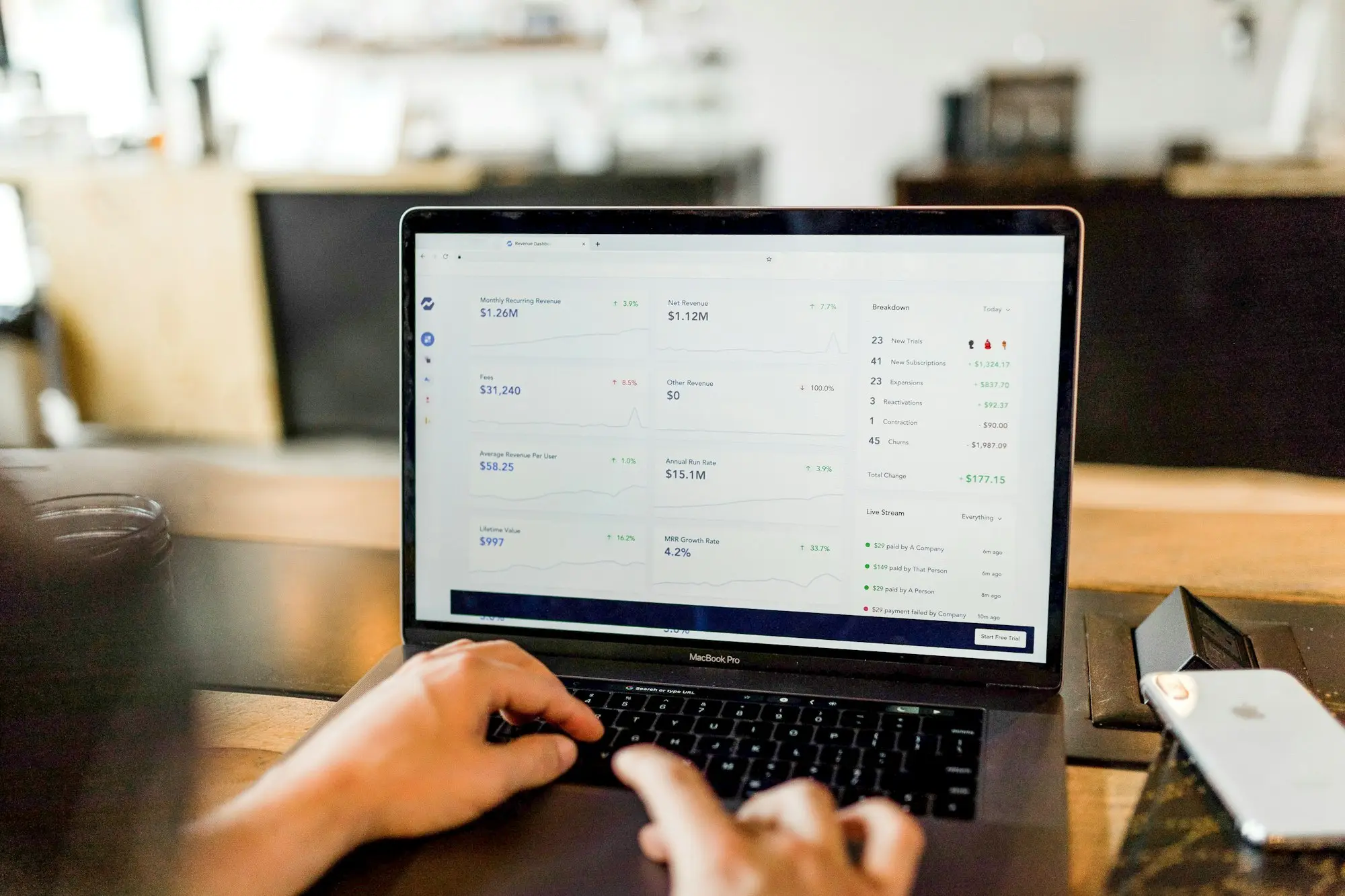 Invoices open in accounting software on a laptop