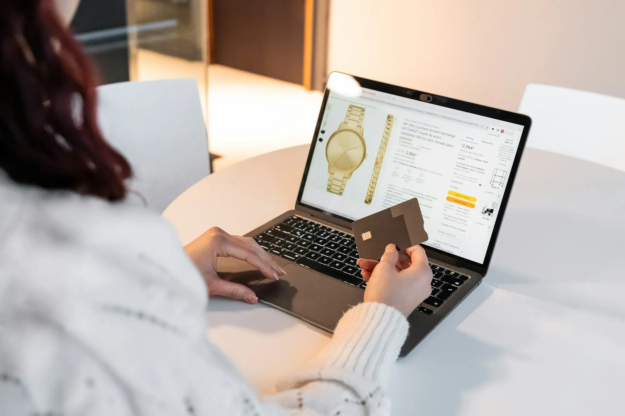 Business owner paying a supplier order online with a card